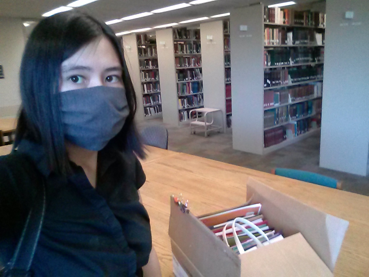 Shelly in mask in library