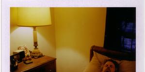 Man on bed and lamp