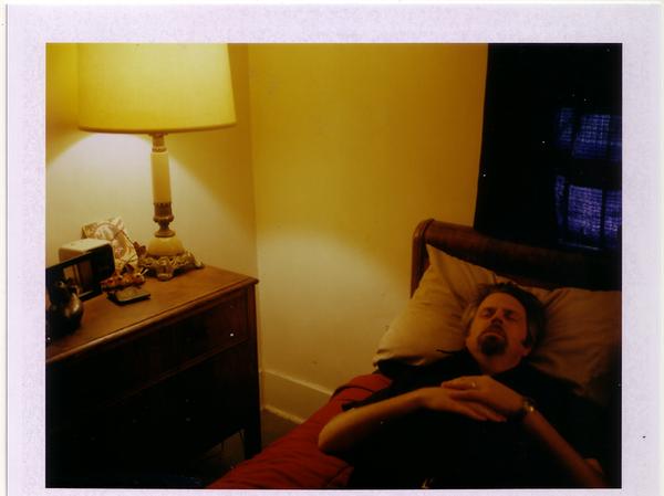 Man on bed and lamp