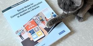 Social Media for Communication and Instruction book and cat