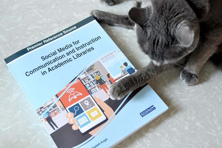 Social Media for Communication and Instruction book and cat