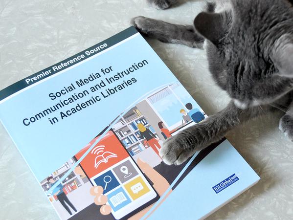 Social Media for Communication and Instruction book and cat
