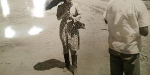 Woman with umbrella in Poston incarceration camp