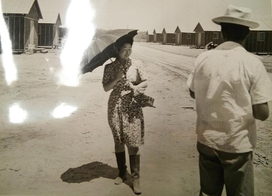 Woman with umbrella in Poston incarceration camp